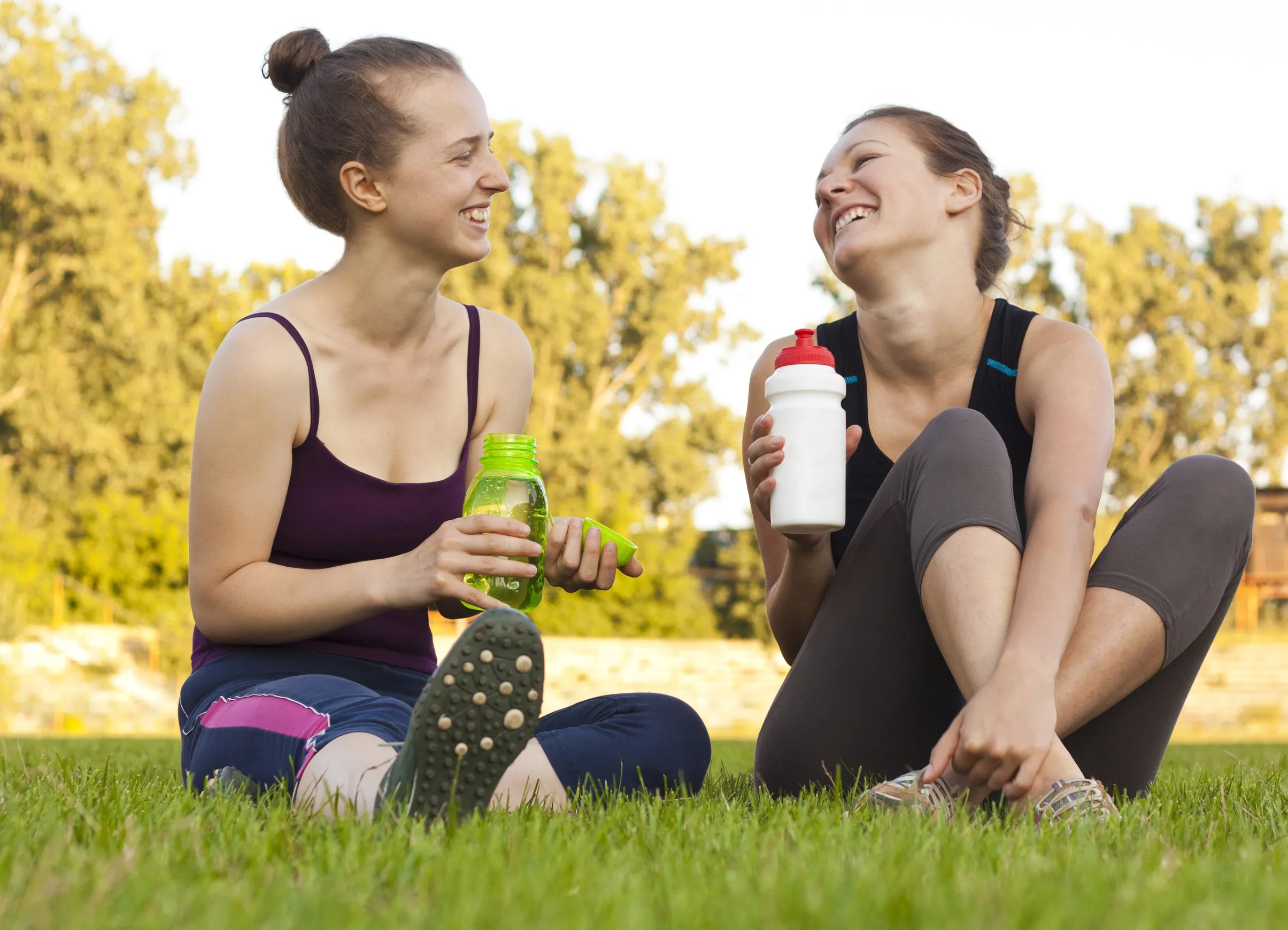 Two girls having a rest, drinking